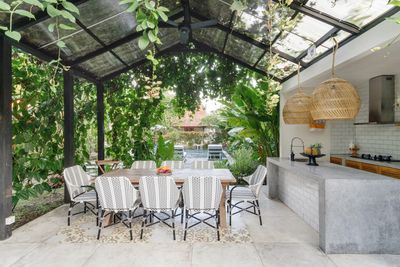 Luxury Outdoor Living Space with Outdoor Kitchen, Pool, Trellis in Ft Lauderdale LeLack Construction