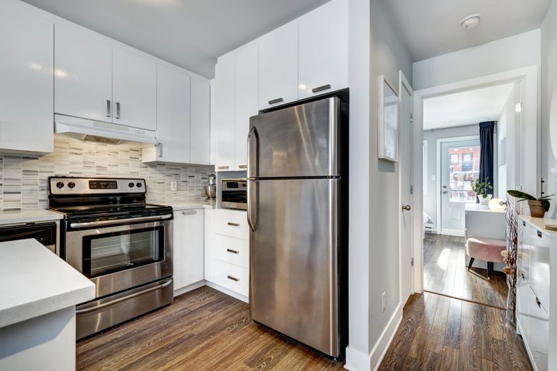 The interior of modern cozy well staged apartment in a building in Montreal including living area, bedrooms, bathroom and terrace