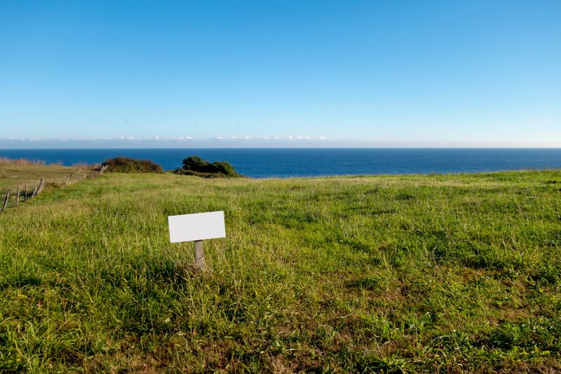 Blank billboard mock up in an on sale property in front of the sea
