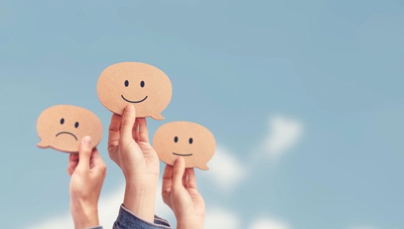Customer showing rating with happy icon on sky background, Customer satisfaction survey concept, copy space.