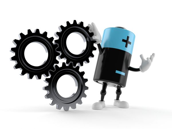 Cartoon battery character holding black gears, symbolizing energy powering machinery.