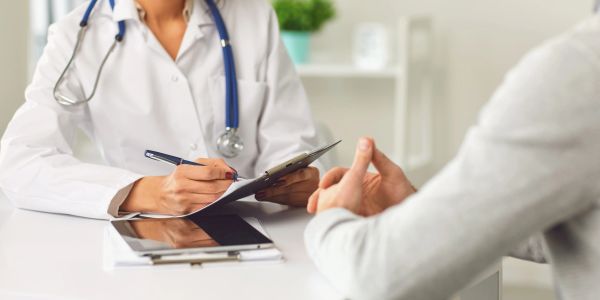 Doctor consulting a patient in a medical office.