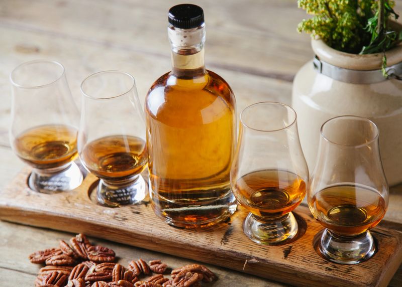 Whiskey flight on rustic wooden surface
