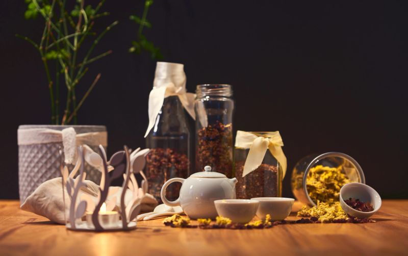 Chrysanthemum tea in Chinese teapot cups; focus only on teapot