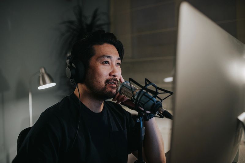 Photo series of a japanese podcaster making video podcast from his home studio.