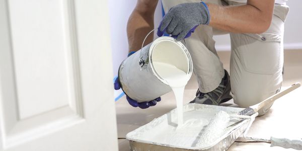 Interior house painter preparing a room for painting in Tallahassee,  Florida