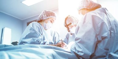 Surgeons performing an operation in a sterile environment.