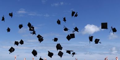 university hats being thrown in the air