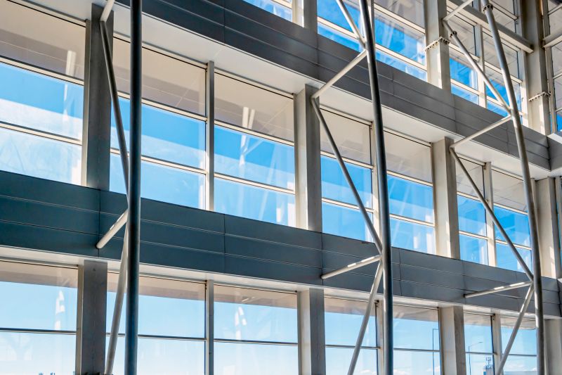 Photo of a modern building ade with glass structure.