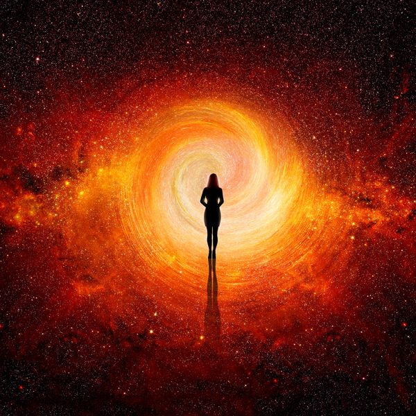 person surrounded by radiant light showing spiritual growth, mindfulness and higher consciousness 