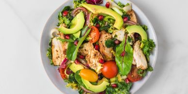 Fresh salad with grilled chicken and avocado.