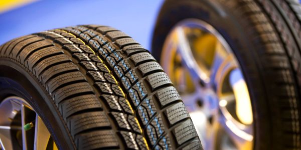 Close-up of car tires with detailed tread patterns.