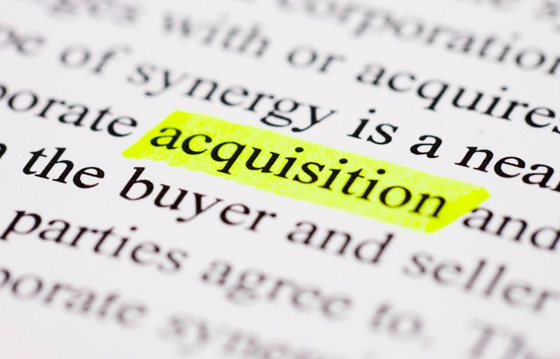 Acquisition highlighted in yellow on printed page.