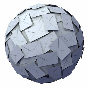 A globe covered entirely with white envelopes symbolizing global communication.