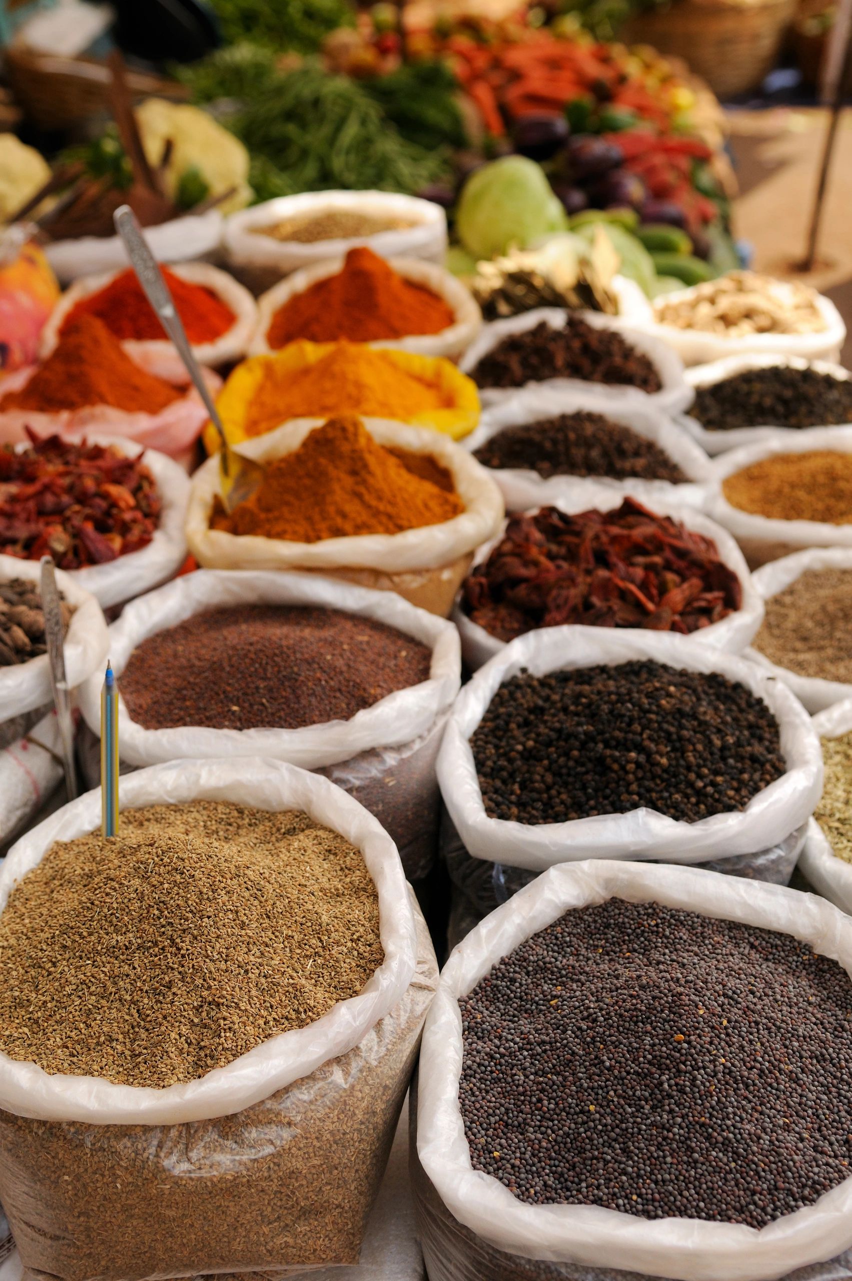 Various spices in sacks at a market.
