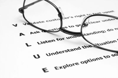 glasses on a text that spells value