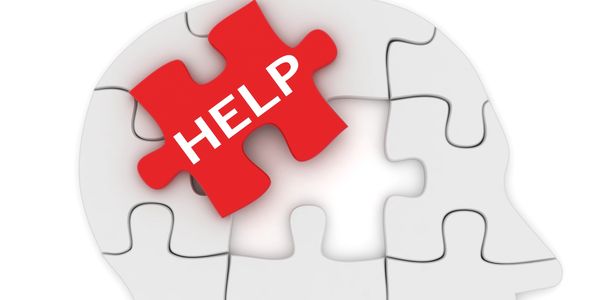 Puzzle piece missing from head with "HELP" written on it.