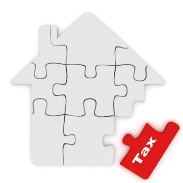 House-shaped puzzle with a red tax piece missing.