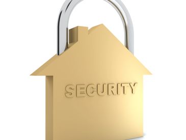 Golden house-shaped padlock symbolizing home security.