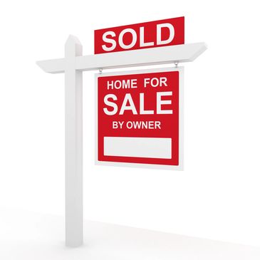 Red and white sold sign for home sale by owner.