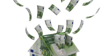 House made of euro bills with money flying away.