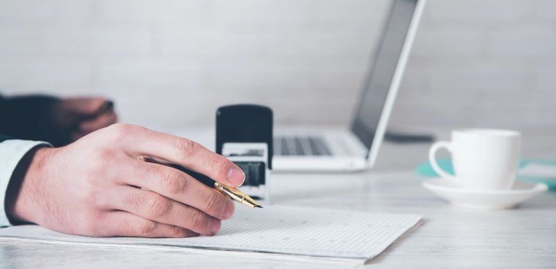 man hand pen with seal and document