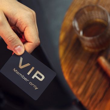 Hand holding a VIP card.