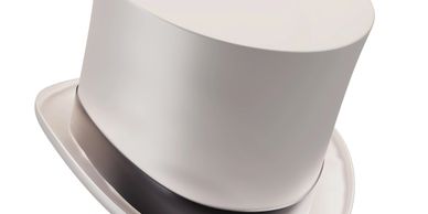 Elegant white top hat with a black band.