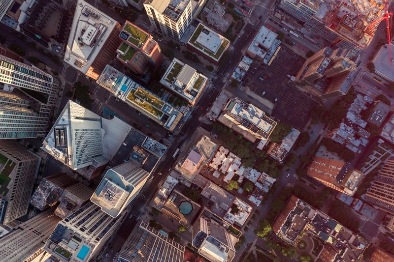 Overhead aerial view of Chicago Downtown skyscrapers. Urban grid with streets and tall buildings. Late afternoon light