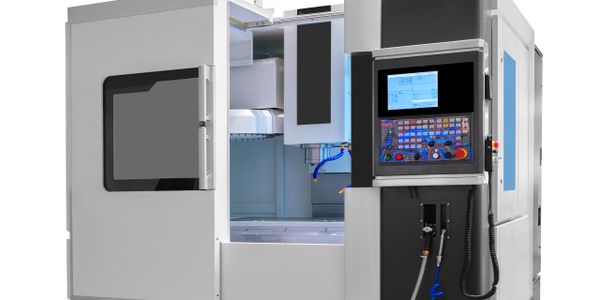 A modern CNC machine with an open door showing the interior workspace.