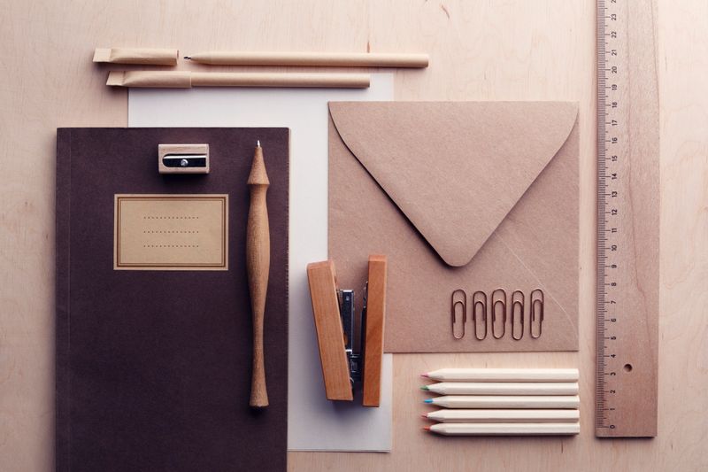 Wood and recycled paper office supplies. Zero waste concept.