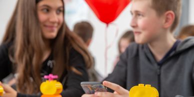 an autistic adolescent girl and an adolescent boy with ADHD build legos and learn friendship skills 