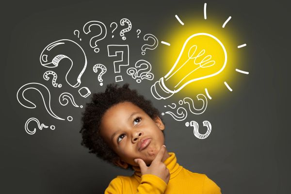 Child thinking with question marks and a glowing light bulb above.