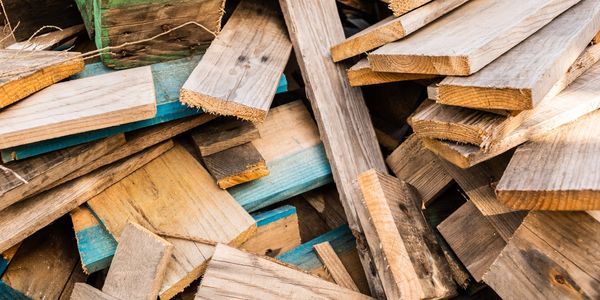 A pile of wooden planks stacked together.