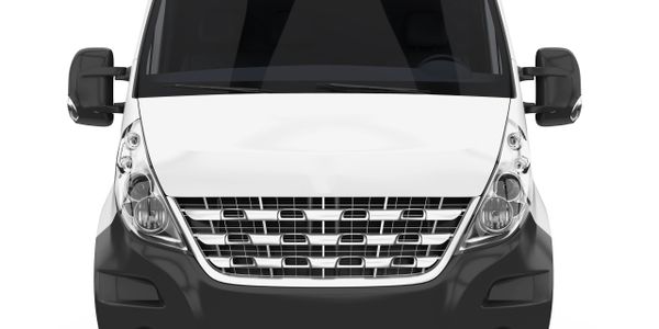 Front view of a white delivery van with black bumper and side mirrors.