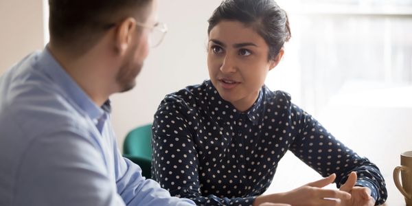 Professional woman in career counseling session discussing transition strategies