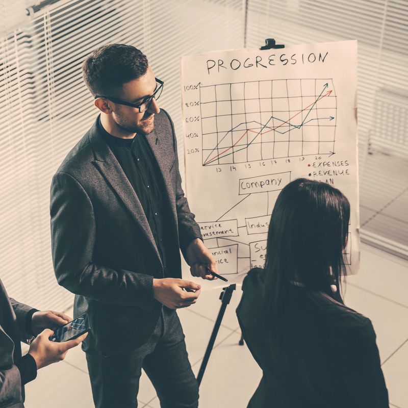 business team enthusiastically discusses the new presentation. office workdays