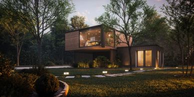 Modern two-story house illuminated at dusk surrounded by trees.