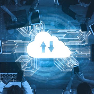 People connected to cloud computing via laptops and mobile devices.