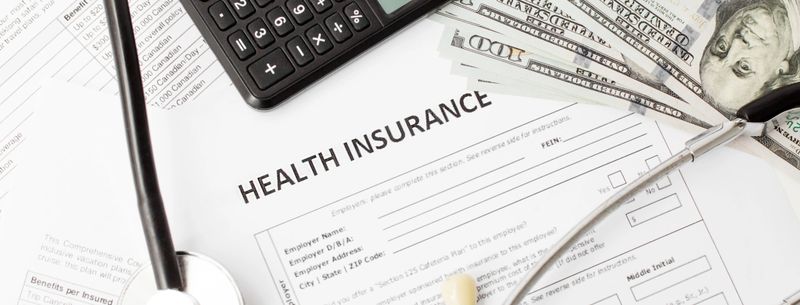 Health insurance application form with banknote and stethoscope concept for life planning