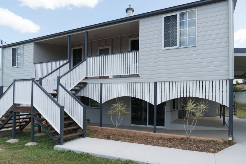 Old Queenslander style home after renovation and repaint, new double stairs