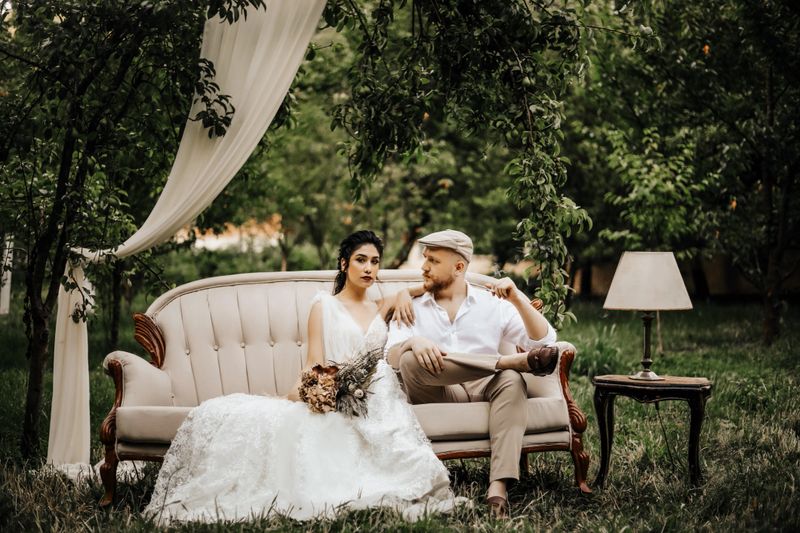 Wedding Photo, Bride and Groom Sitting On The Sofa and Posing