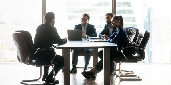 People having a business meeting in a bright office.