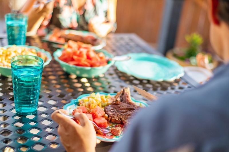 In Western Colorado Young Family Millennial Parents with Female Child Cookout BBQ Backyard Outing with Matching 4K Video Available for this BBQ photo Series (Shot with Canon 5DS 50.6mp photos professionally retouched - Lightroom / Photoshop - original size 5792 x 8688 downsampled as needed for clarity and select focus used for dramatic effect)