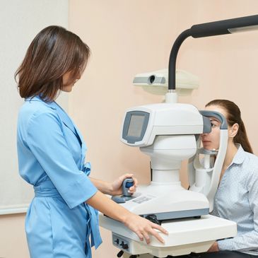 Eye examination in progress with advanced diagnostic equipment.