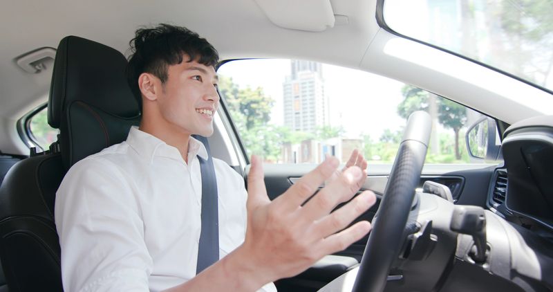 business asian man experience to riding an autonomous self driving car