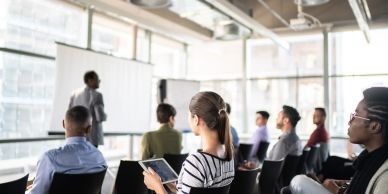 People attending a presentation in a modern room.