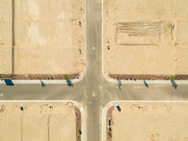 Aerial shot of suburban homes under construction in Marana, Arizona.