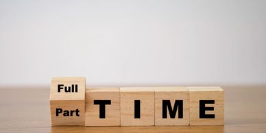 Wooden blocks showing a choice between full-time and part-time.