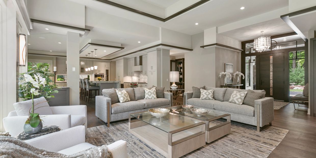 Modern living room with neutral tones and elegant furniture.